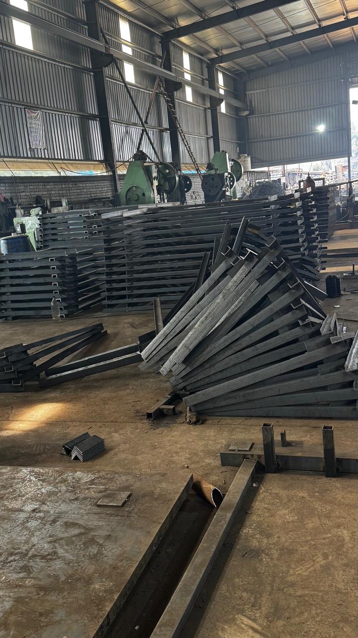 Fabricated steel sections organised on the factory floor