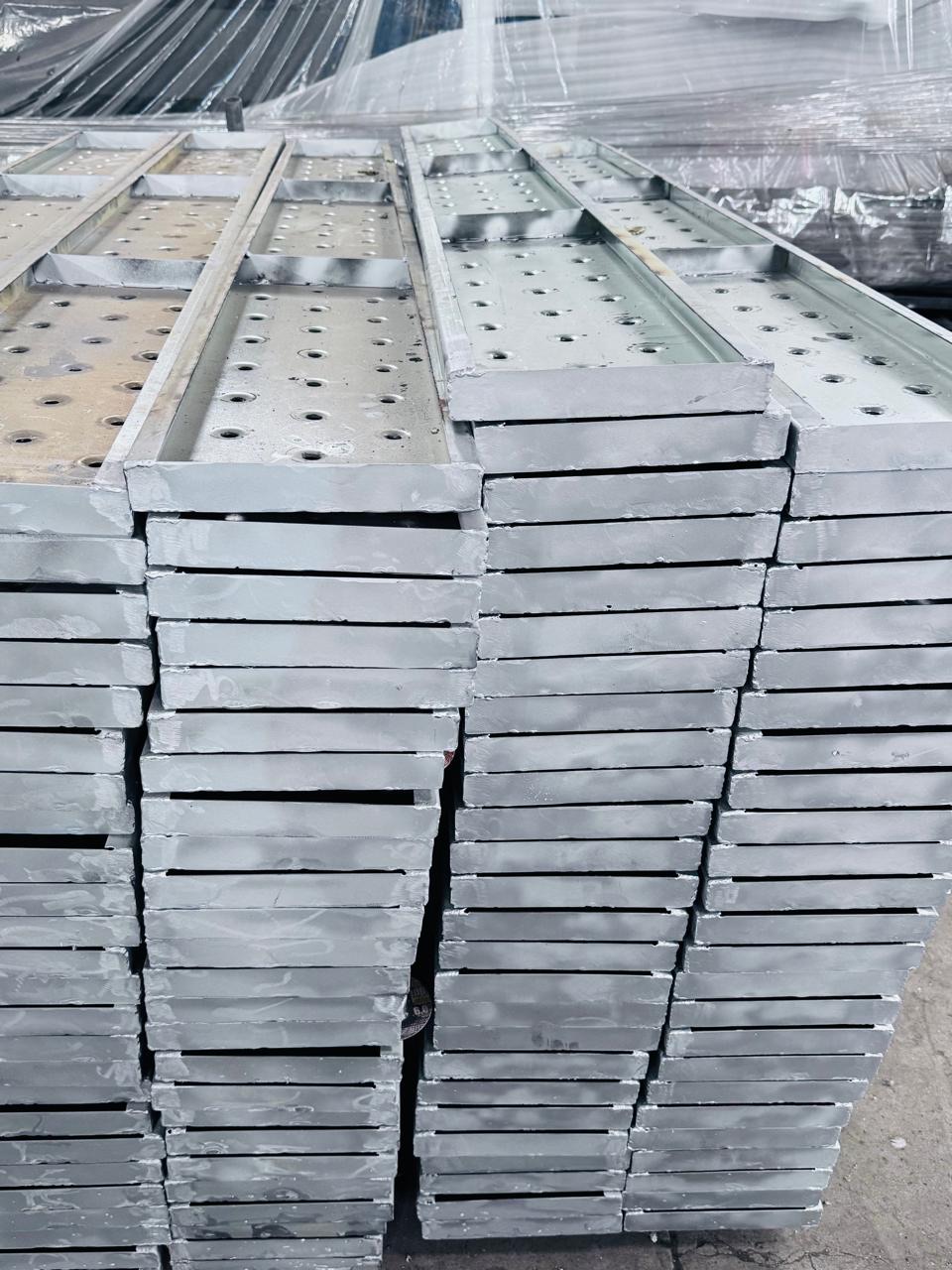 Stacked perforated steel plates after fabrication